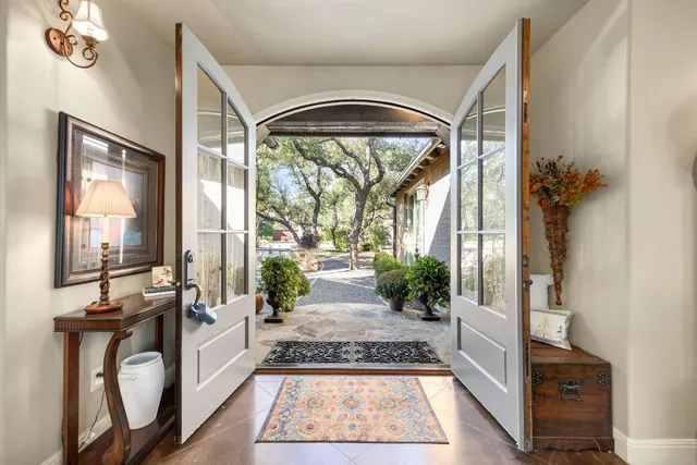 a view of a dining room with furniture wooden floor and chandelier