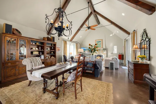 a living room with furniture ceiling fan and a rug