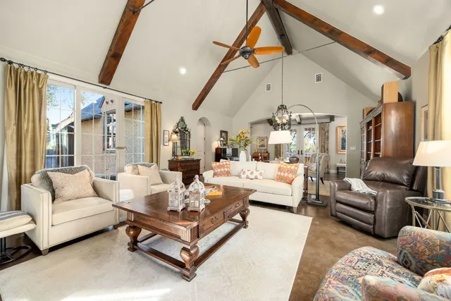 a kitchen with stainless steel appliances a sink a stove and cabinets