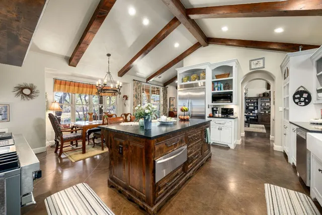 a stove top oven sitting inside of a kitchen