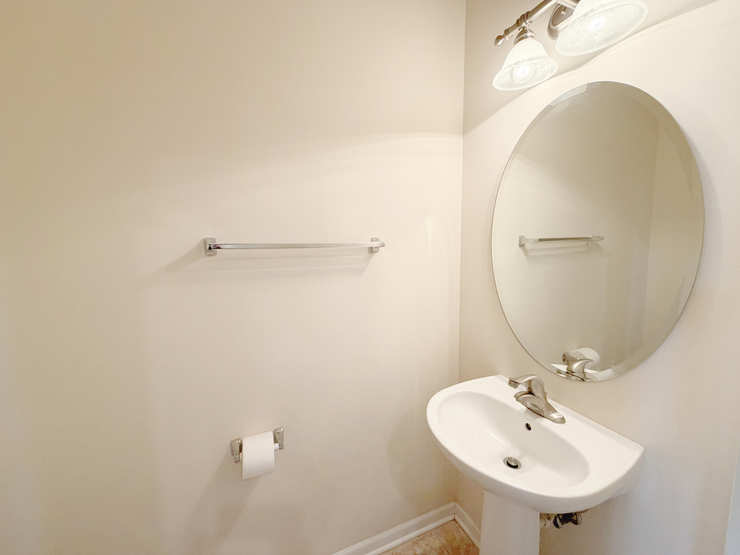 Undisclosed Address Elgin, IL 60120 - Photo 11 of 22 a bathroom with a sink and a mirror