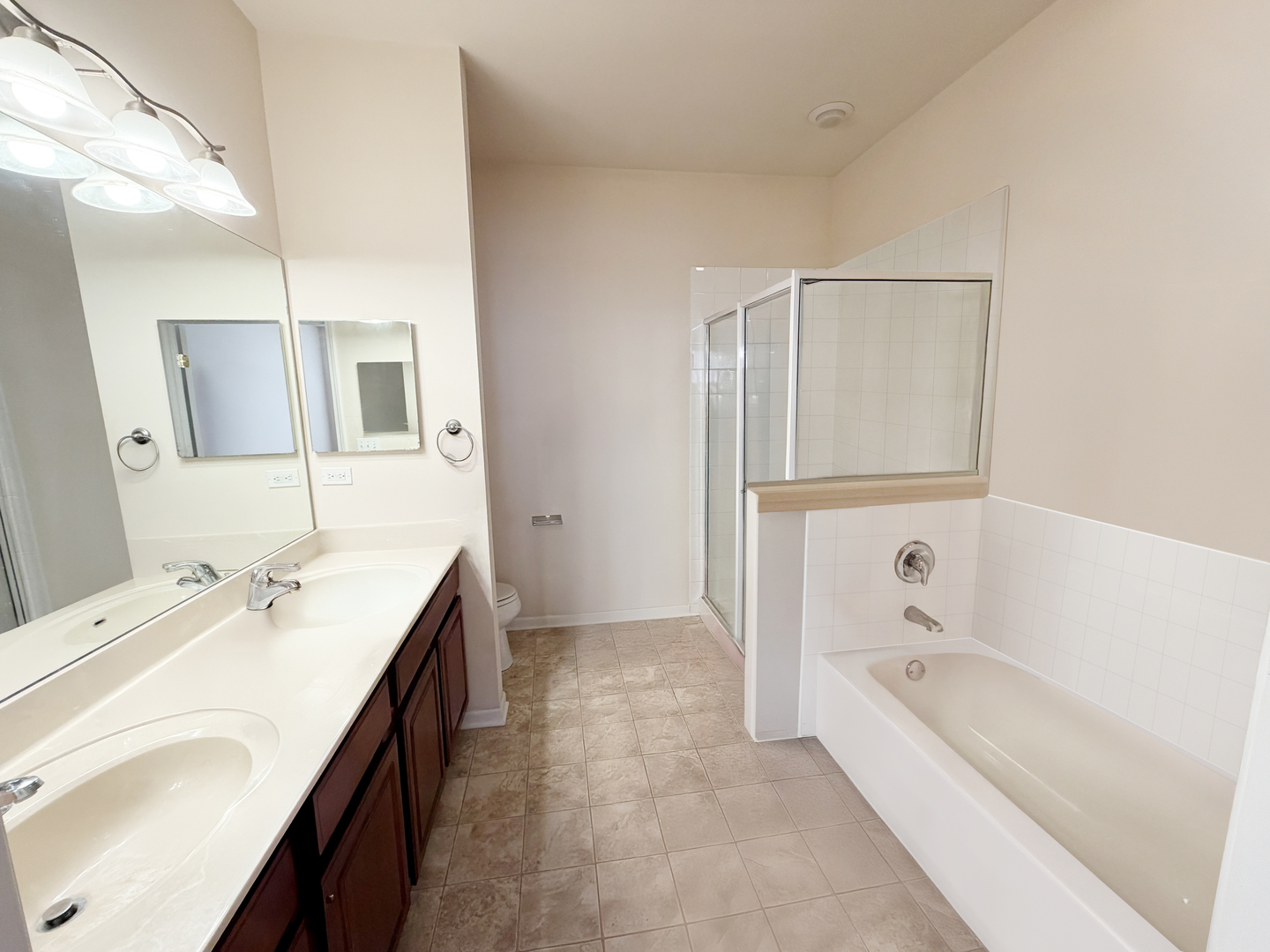 Undisclosed Address Elgin, IL 60120 - Photo 19 of 22 a bathroom with a tub sink and mirror