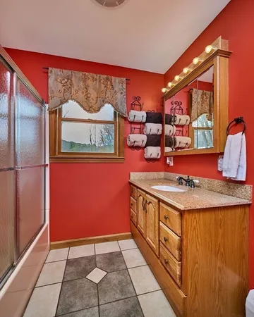 a kitchen with stainless steel appliances granite countertop a stove and a refrigerator