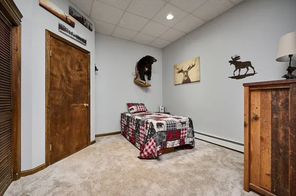 a room with a bed and cabinets