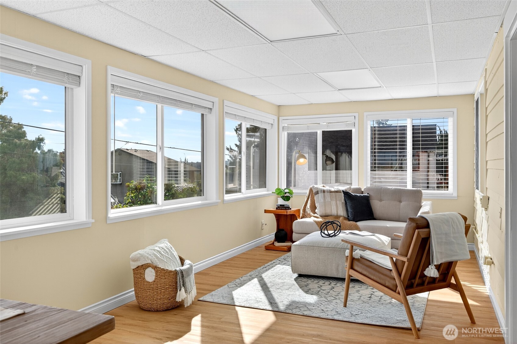 3846 35th Avenue Southwest Seattle, WA 98126 - Photo 19 of 40 a living room with furniture and floor to ceiling windows