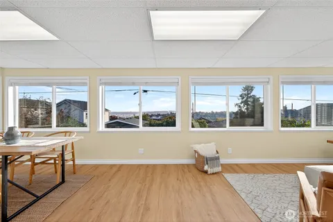 a living room with a large window and table