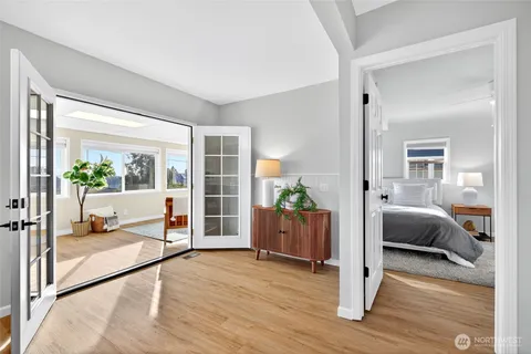 a bedroom with furniture and a window