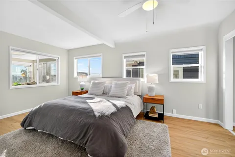 a bed room with a bed and a window