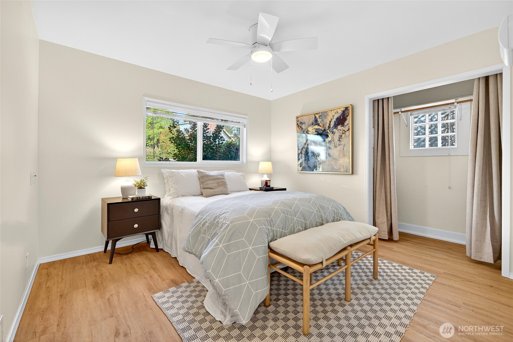 3846 35th Avenue Southwest Seattle, WA 98126 - Photo 26 of 40 a bedroom with a bed and a painting on the wall