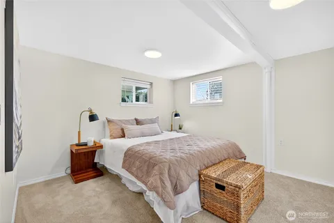 a bedroom with bed and window