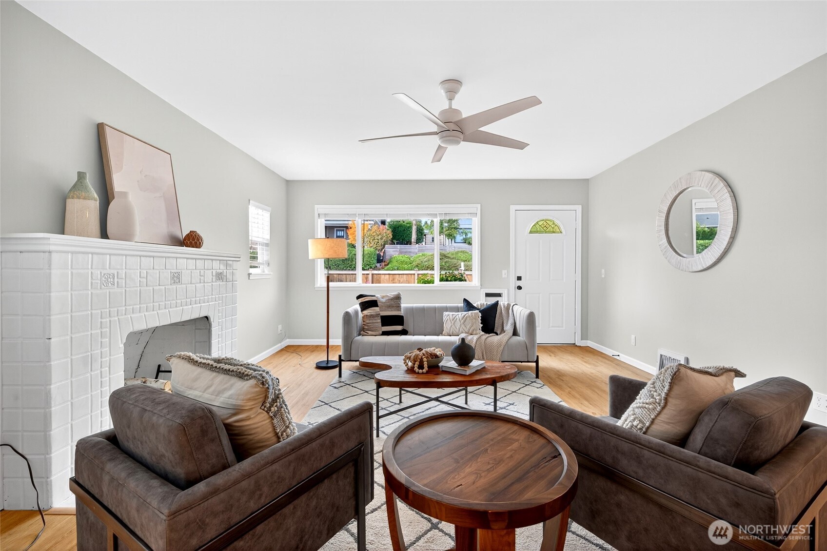 3846 35th Avenue Southwest Seattle, WA 98126 - Photo 7 of 40 a living room with furniture a fireplace and a large window