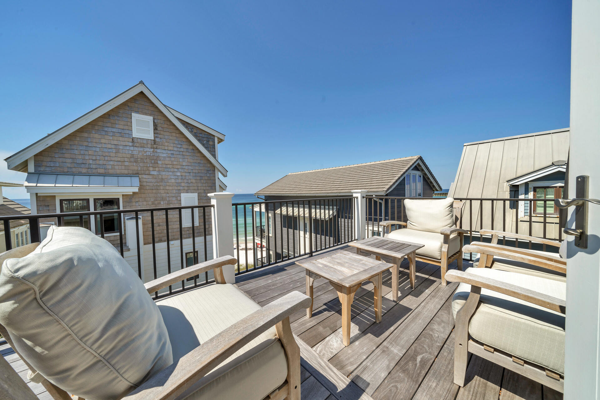 256 Winston Lane Inlet Beach, FL 32461 - Photo 23 of 49 a view of a patio with couches chairs and wooden floor