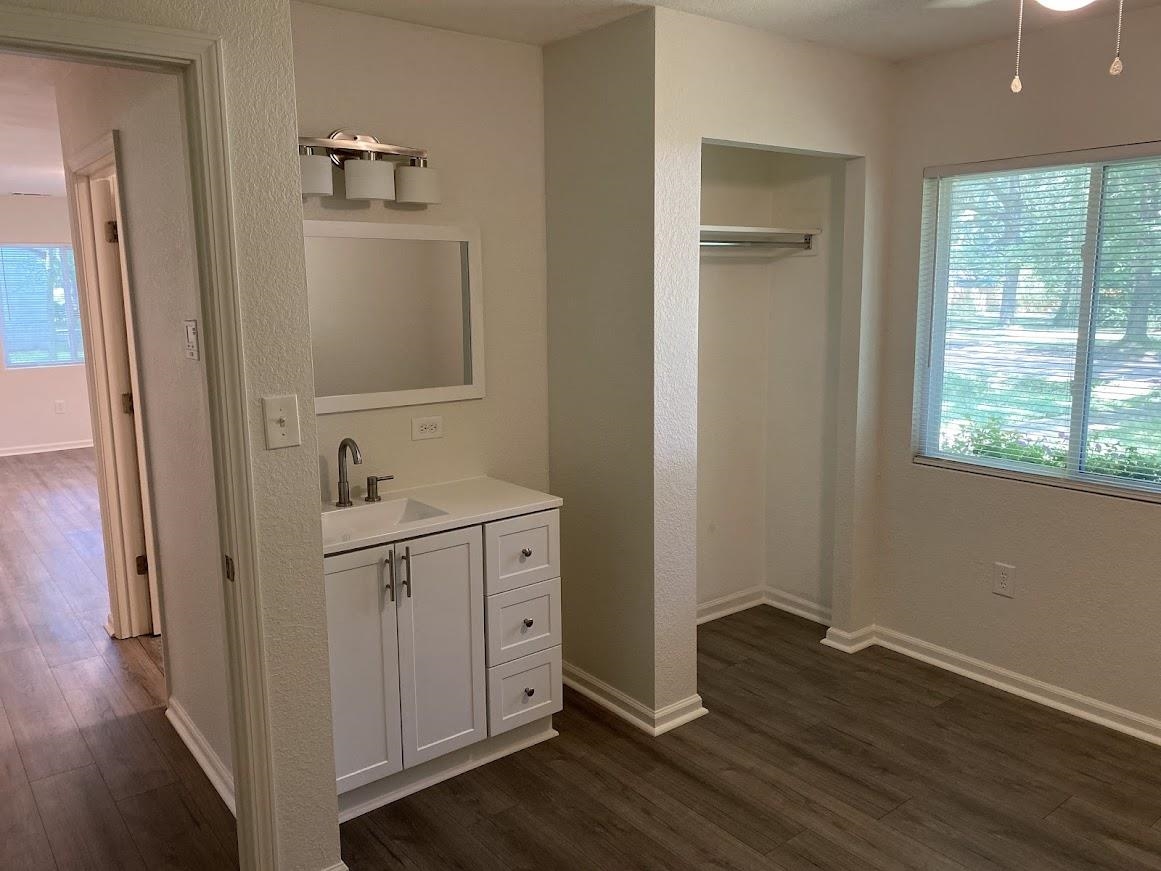 7838 Nimitz Road Millington, TN 38053 - Photo 12 of 14 Bathroom with a healthy amount of sunlight and hardwood / wood-style floors