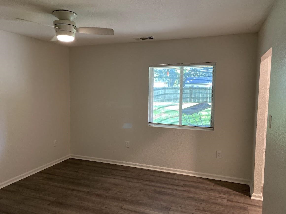 7838 Nimitz Road Millington, TN 38053 - Photo 7 of 14 Empty room featuring dark hardwood / wood-style flooring and ceiling fan