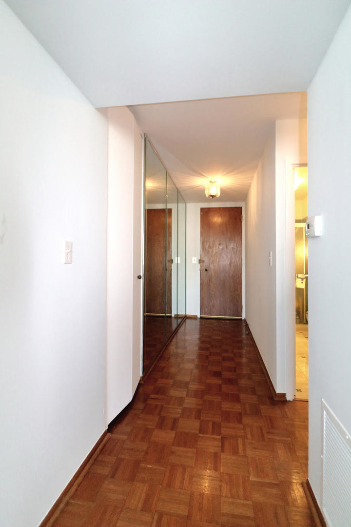 6033 North Sheridan Road, Unit 23F Chicago, IL 60660 - Photo 4 of 30 a view of hallway with wooden floor