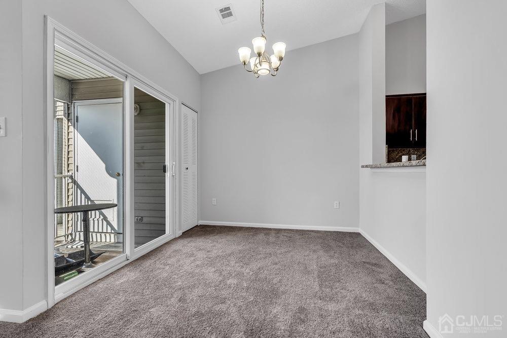 1236 Edpas Road New Brunswick, NJ 08901 - Photo 9 of 26 en empty room with windows and entrance