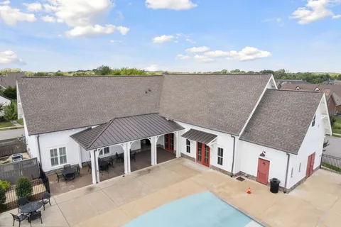 a view of swimming pool with seating space