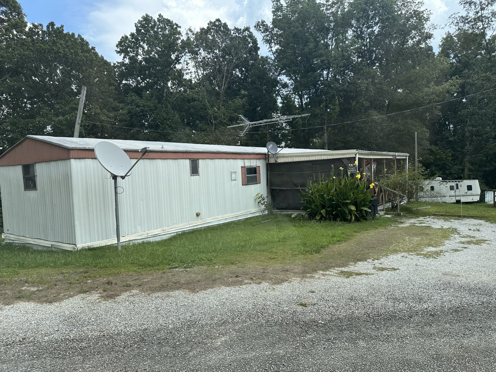 84 Perryville Estate Lane Parsons, TN 38363 - Photo 1 of 16 a view of a house with backyard and garden