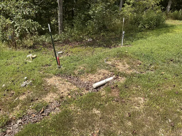 a view of a wooden fence and a bench