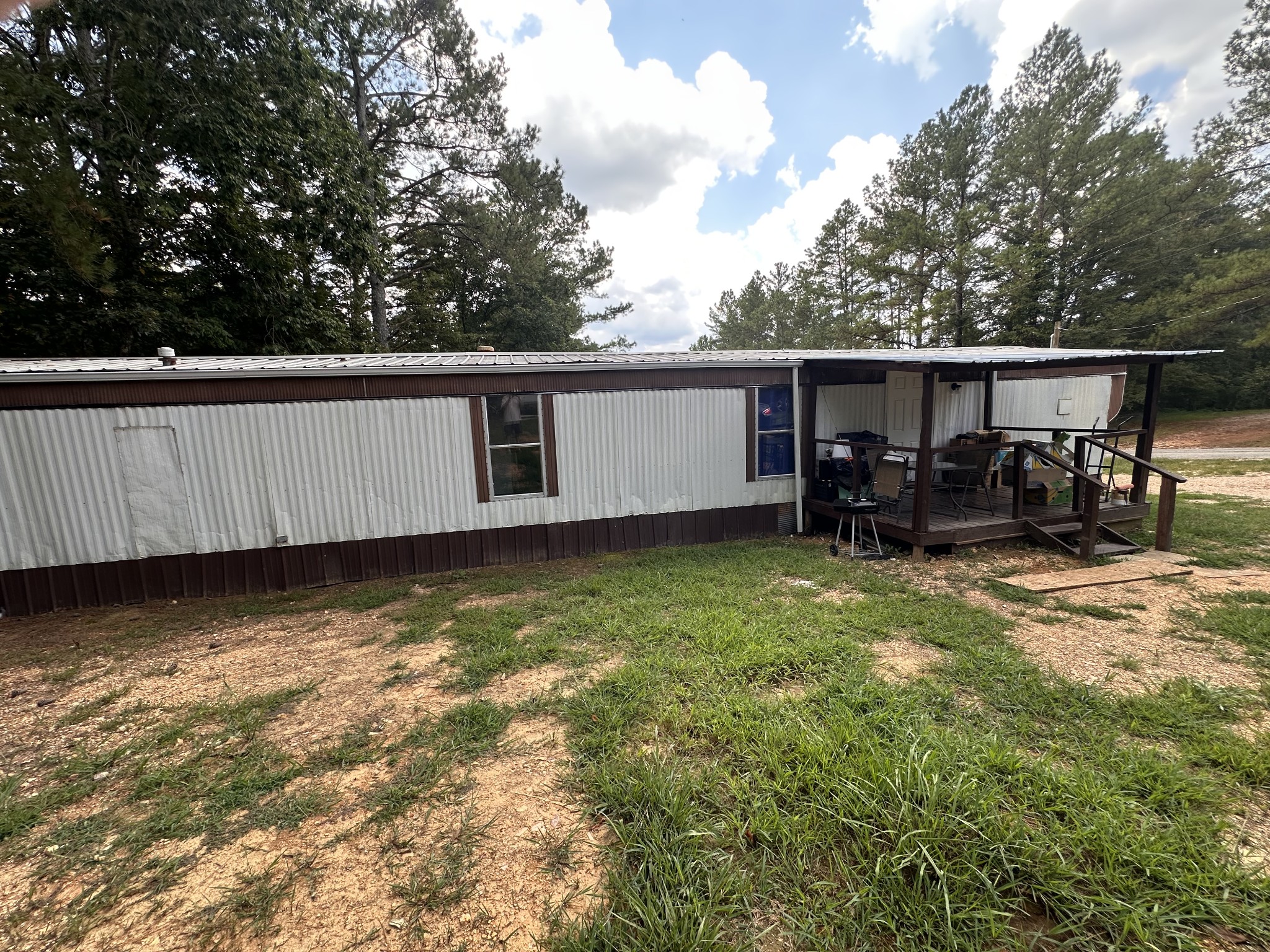 84 Perryville Estate Lane Parsons, TN 38363 - Photo 2 of 16 a backyard of a house with table and chairs