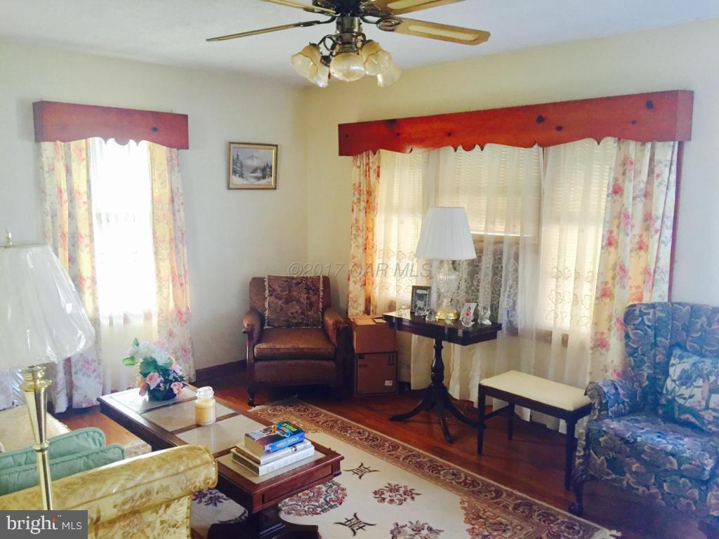 10817 Toddville Road Chance, MD 21821 - Photo 8 of 21 a living room with furniture and a large window