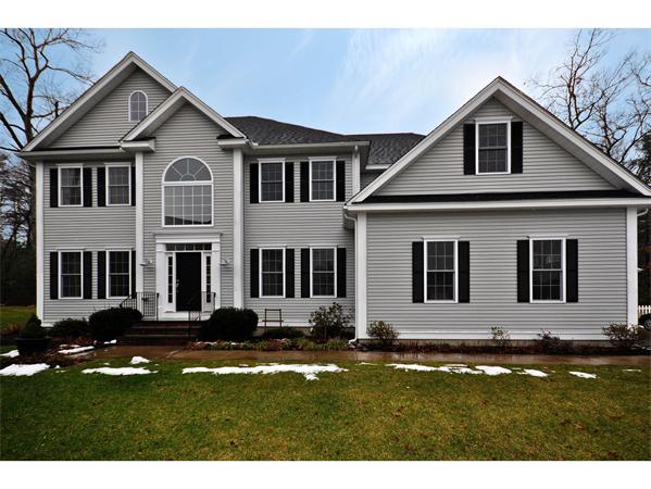 5 Squirrel Hill Road Acton, MA 01720 - Photo 1 of 30 a front view of a house with a yard