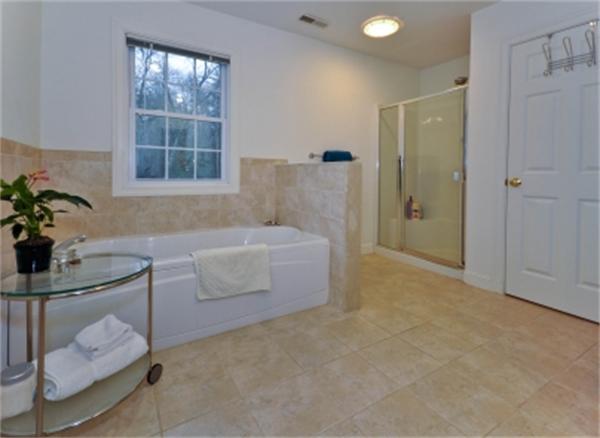 5 Squirrel Hill Road Acton, MA 01720 - Photo 23 of 30 a bathroom with a tub and shower