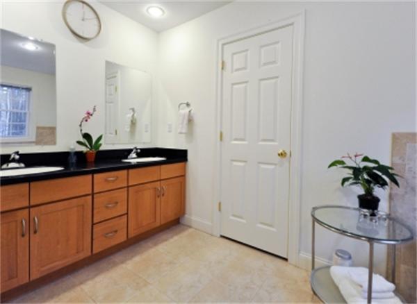 5 Squirrel Hill Road Acton, MA 01720 - Photo 24 of 30 a bathroom with a granite countertop sink a mirror and a shower