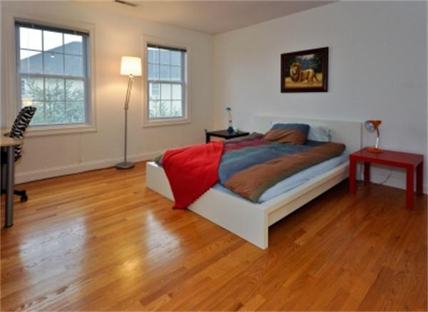 5 Squirrel Hill Road Acton, MA 01720 - Photo 25 of 30 a bedroom with a bed and wooden floor