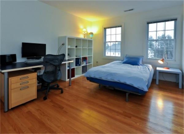 5 Squirrel Hill Road Acton, MA 01720 - Photo 26 of 30 a bedroom with a bed and wooden floor