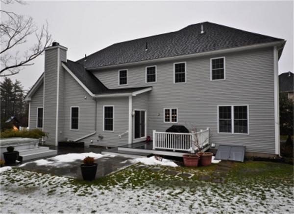 5 Squirrel Hill Road Acton, MA 01720 - Photo 29 of 30 a front view of a house with a yard