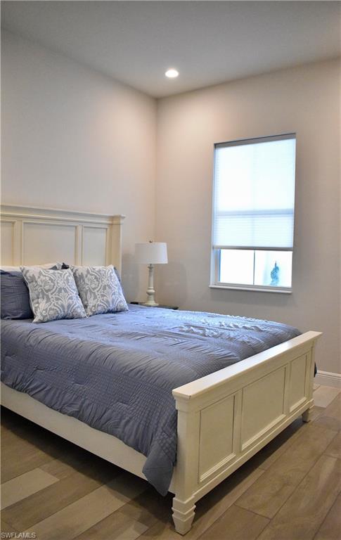 9175 Cayman Drive Naples, FL 34114 - Photo 15 of 31 a bedroom with a bed and window
