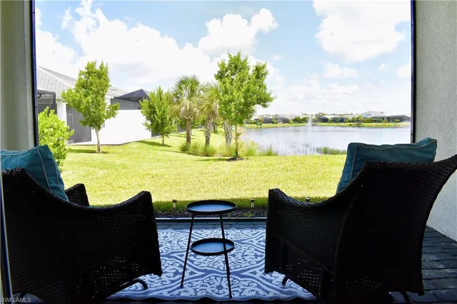 a view of a lake with outdoor seating