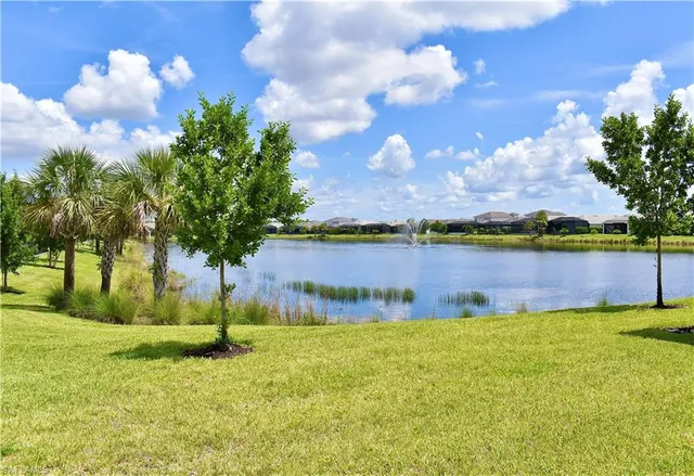 a view of a lake with a yard