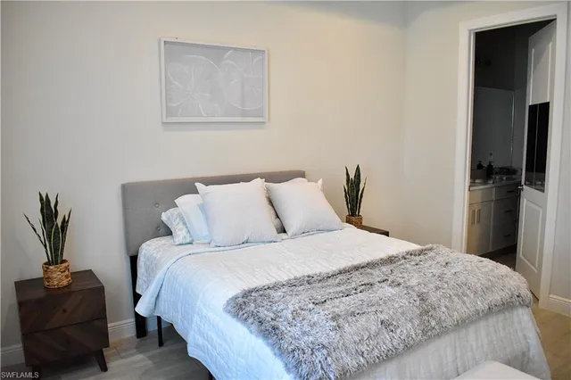 a bedroom with a bed and a couch