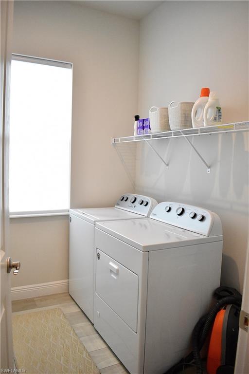 9175 Cayman Drive Naples, FL 34114 - Photo 9 of 31 a utility room with dryer and washer