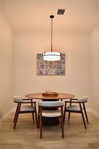 a room with a table and chairs