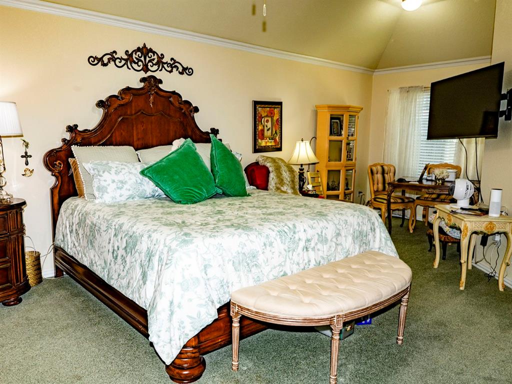 9028 Racquet Club Drive Fort Worth, TX 76120 - Photo 17 of 26 a bed room with a bed window and a chair