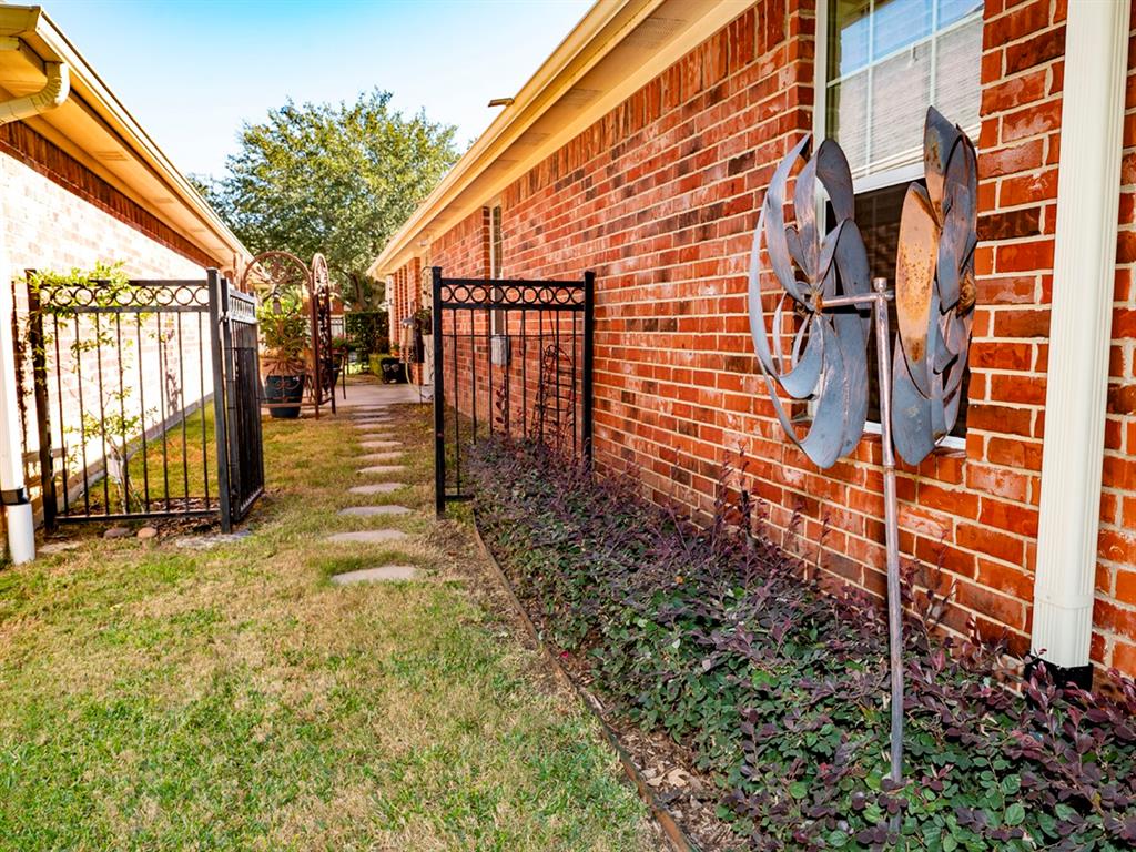 9028 Racquet Club Drive Fort Worth, TX 76120 - Photo 6 of 26 a backyard of a house with barbeque oven table and chairs