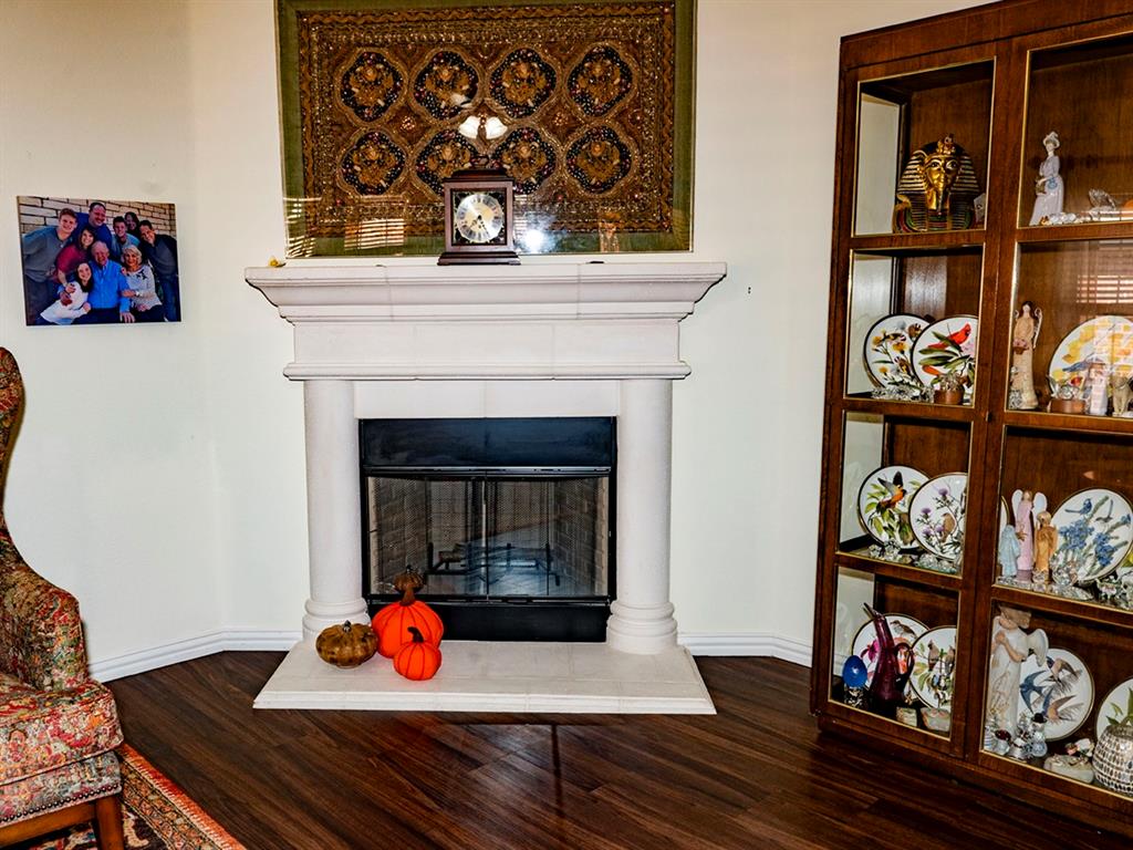 9028 Racquet Club Drive Fort Worth, TX 76120 - Photo 10 of 26 a living room with furniture and a fireplace