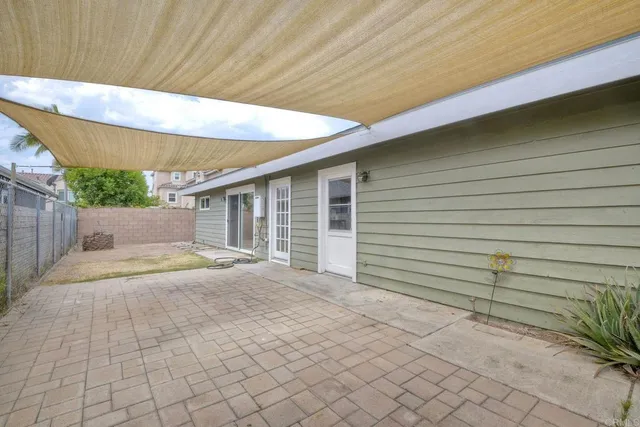 a house view with a backyard space