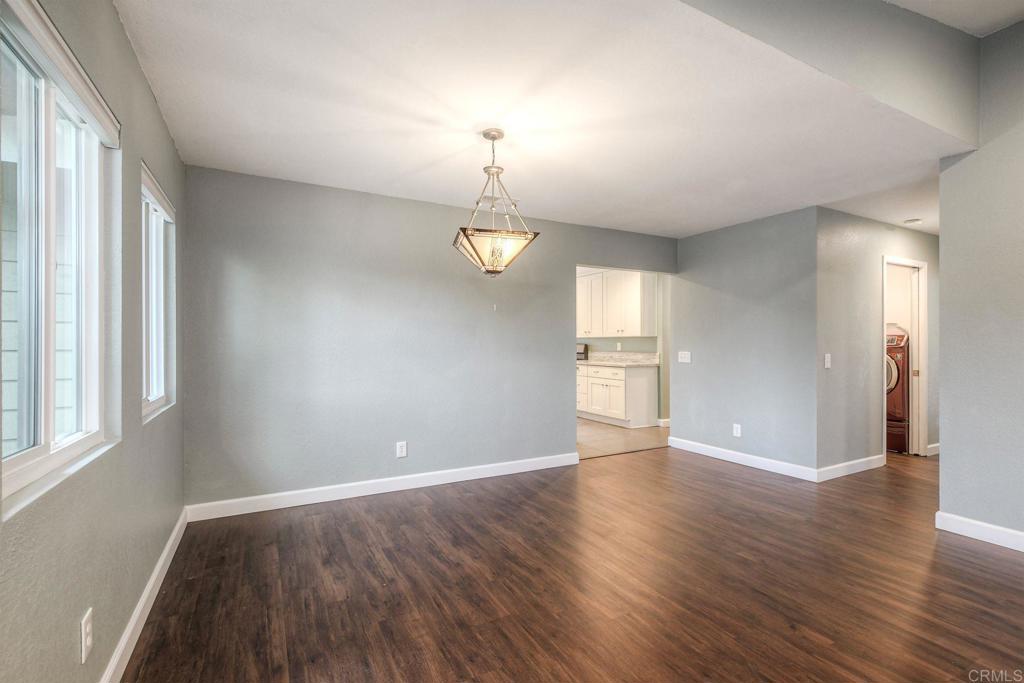 769 Magnolia Avenue, Unit B Carlsbad, CA 92008 - Photo 5 of 25 a view of an empty room with window and wooden floor