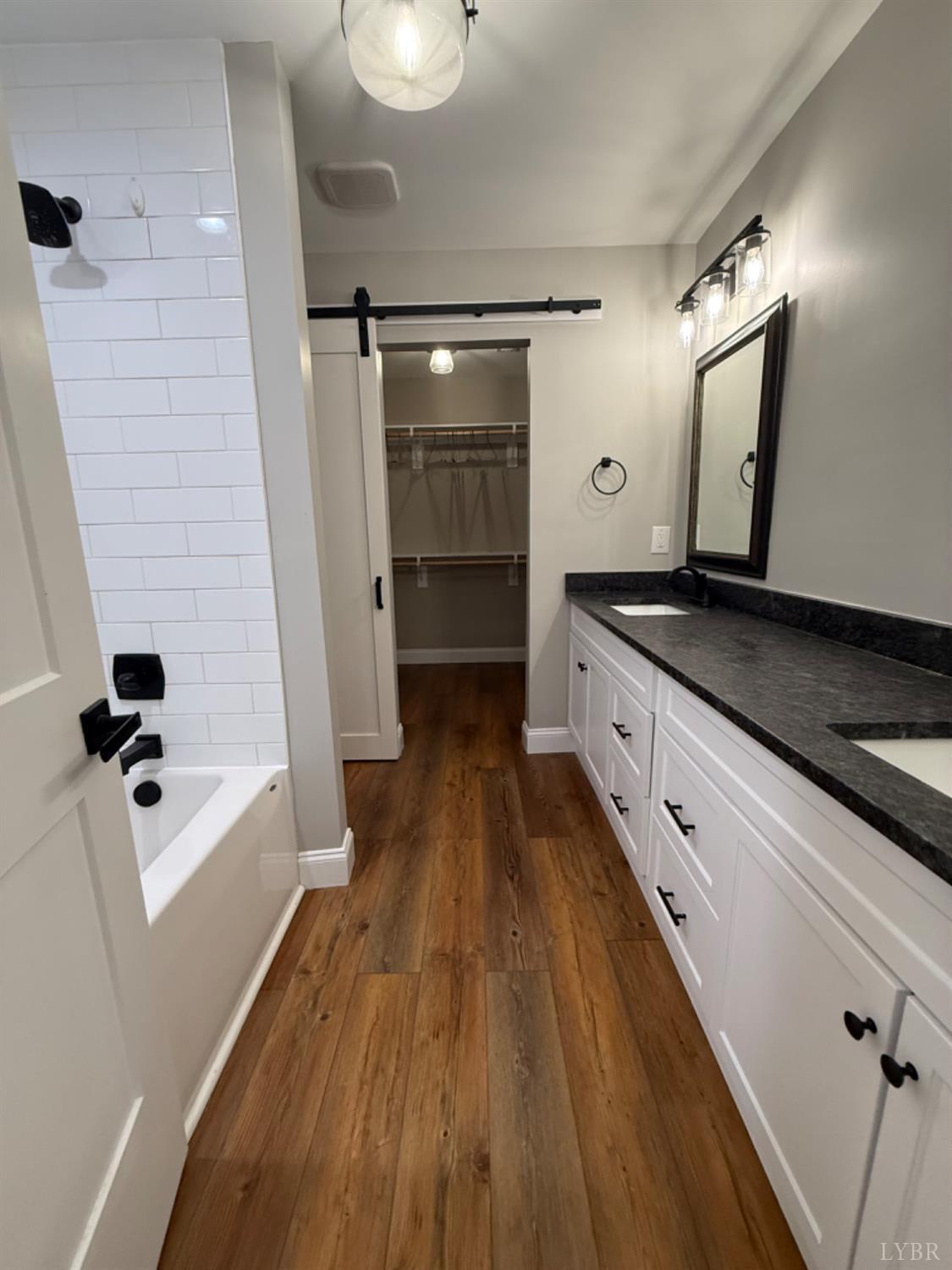 129 Ned Brown Road Amherst, VA 24521 - Photo 18 of 30 a bathroom with a sink a mirror and shower