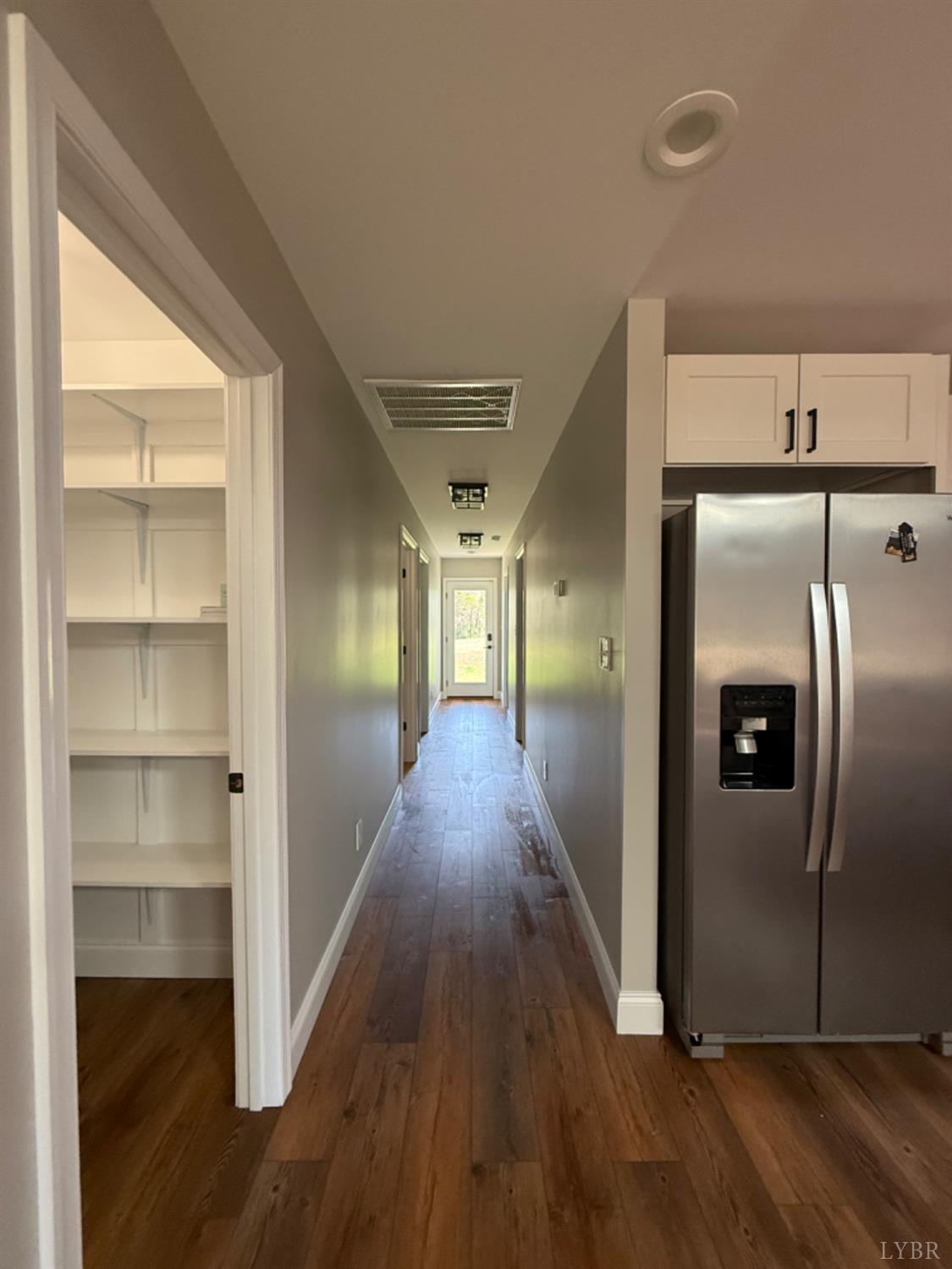 129 Ned Brown Road Amherst, VA 24521 - Photo 9 of 30 a view of a hallway with wooden floor and staircase