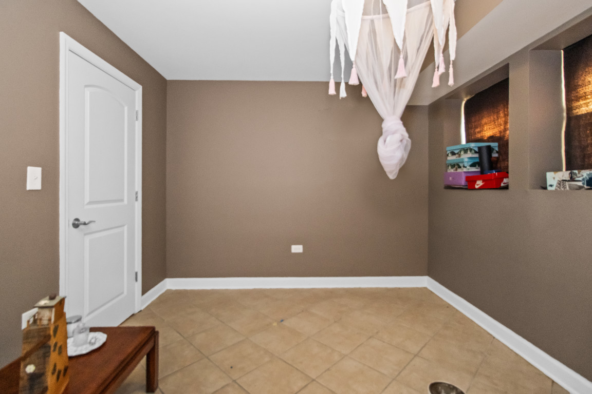 2710 North Artesian Avenue Chicago, IL 60647 - Photo 14 of 61 a view of a room with rack and wooden floor