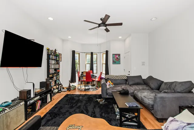 a kitchen with stainless steel appliances granite countertop a stove refrigerator and microwave