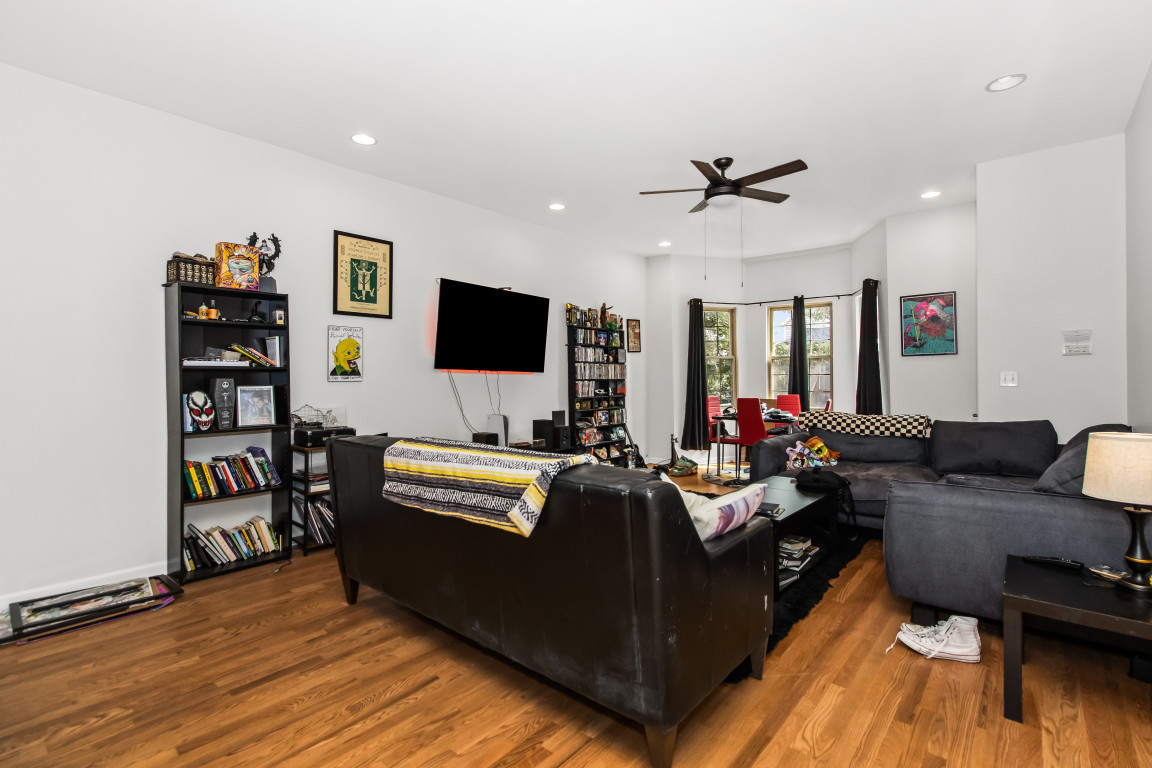 2710 North Artesian Avenue Chicago, IL 60647 - Photo 20 of 61 a living room with furniture and a flat screen tv