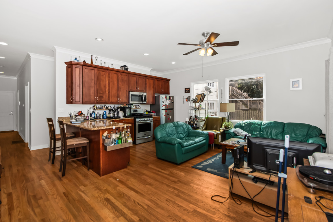 2710 North Artesian Avenue Chicago, IL 60647 - Photo 2 of 61 a living room with furniture and a wooden floor