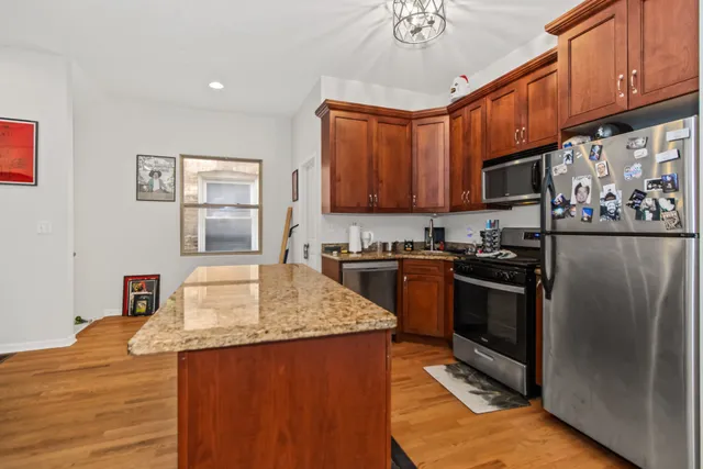 a bedroom with a bed and a flat tv screen