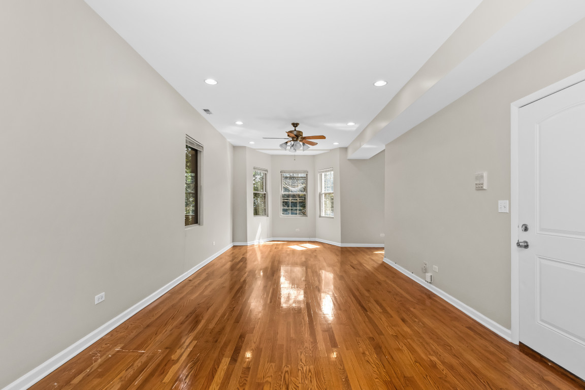 2710 North Artesian Avenue Chicago, IL 60647 - Photo 30 of 61 wooden floor in an empty room with a window